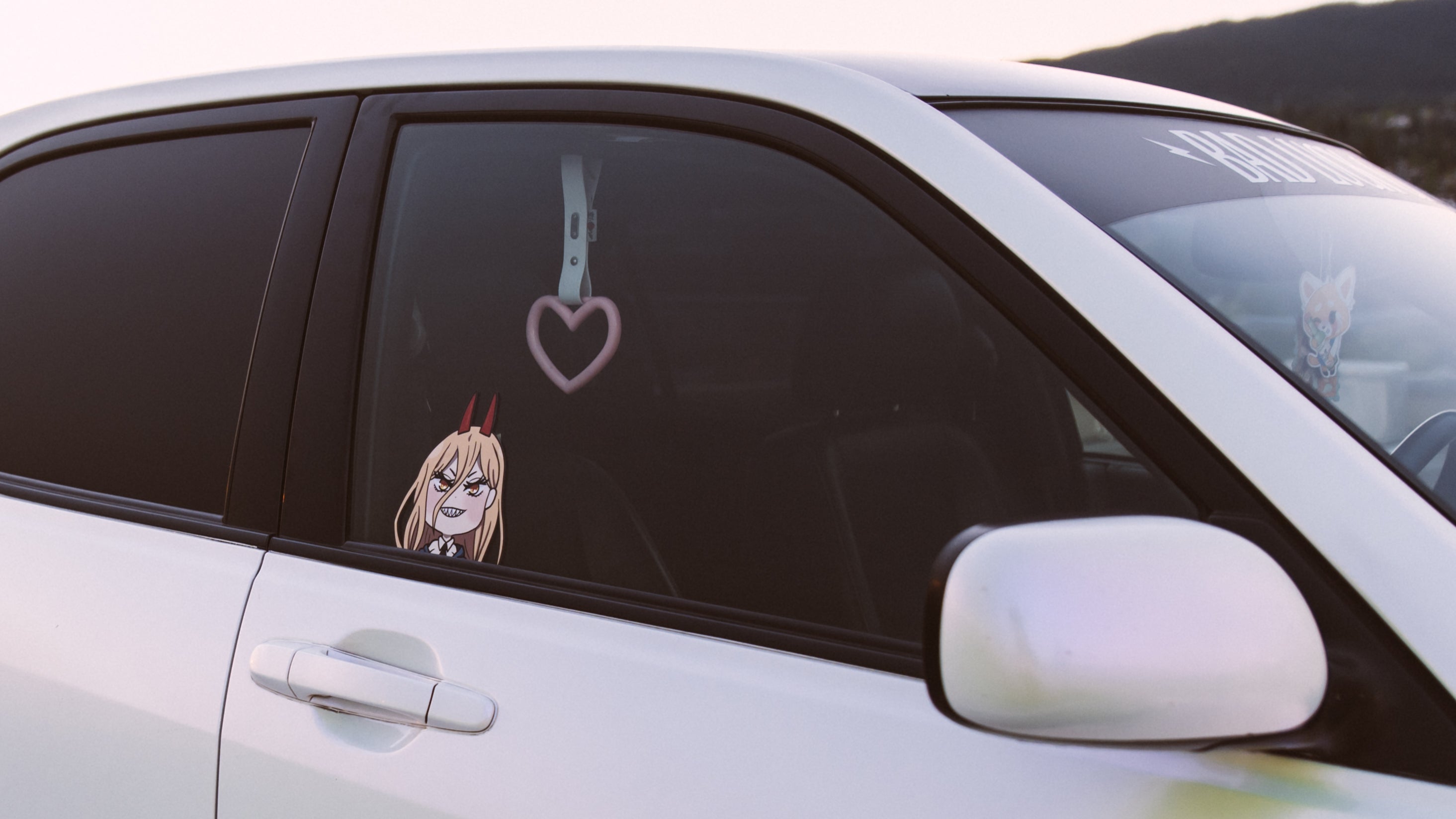 power from chainsaw man peeking sticker with a heart JDM tsurikawa and a aggretsuko air freshener hanging in the background
